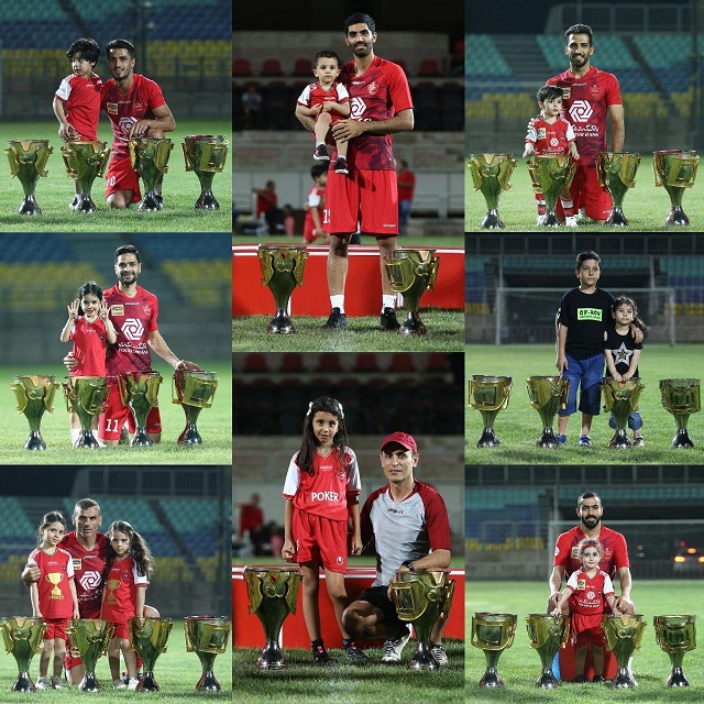 عکس یادگاری پرسپولیسی‌ها به همراه فرزندان‌شان در کنار چهار جام قهرمانی